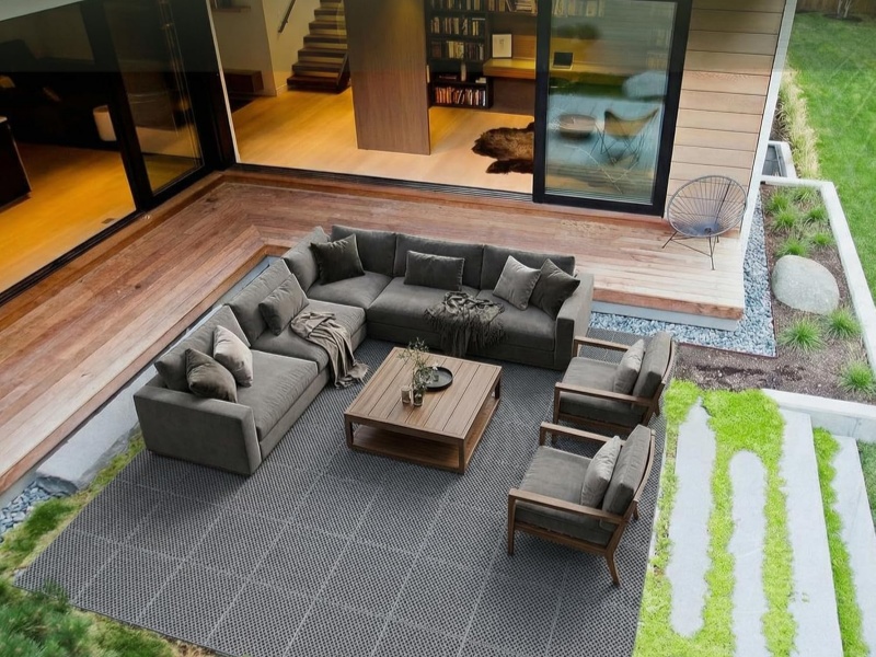 Premium Romlits interlocking deck tiles on a modern outdoor patio